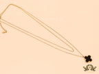 Gold plated chain with black onyx clover pendant