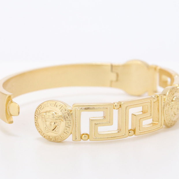 Gold plated designer bracelet with gold plated Medusa face motif