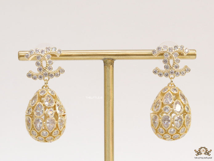 Golden twin C cz earrings with fancy cz lobe shape drops