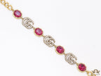 Gold plated linked chain bracelet with gold plated cubic zirconia stones twin G alphabet motifs and gold plated pink cubic zirconia stones