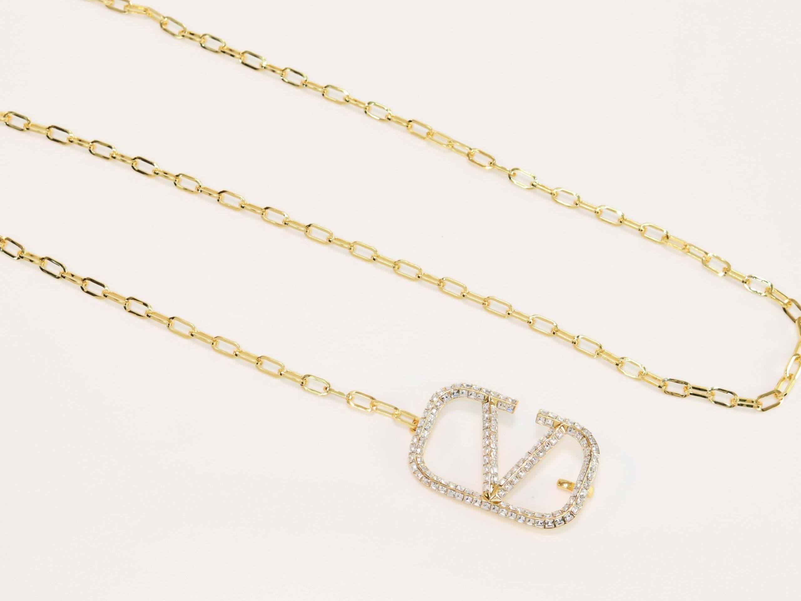 Open V and gold chain waist belt