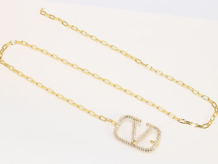 Open V and gold chain waist belt