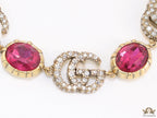 Gold plated linked chain bracelet with gold plated cubic zirconia stones twin G alphabet motifs and gold plated pink cubic zirconia stones