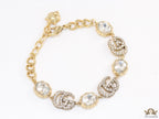 Gold plated linked chain bracelet with gold plated cubic zirconia stones twin G alphabet motifs and gold plated cubic zirconia stones