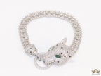 Platinum plated bracelet with cubic zirconia stones panther face motif with green cubic zirconia stone details and cubic zirconia stones disc