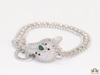 Platinum plated bracelet with cubic zirconia stones panther face motif with green cubic zirconia stone details and cubic zirconia stones disc