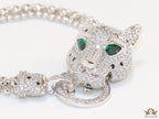 Platinum plated bracelet with cubic zirconia stones panther face motif with green cubic zirconia stone details and cubic zirconia stones disc