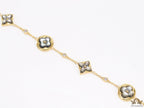 Sleek gold plated chain style bracelet with gold plated grey mother of pearl flower designs