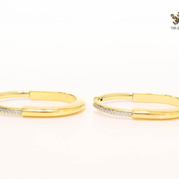 Alphabet T & Co. gold and cz oval hoops