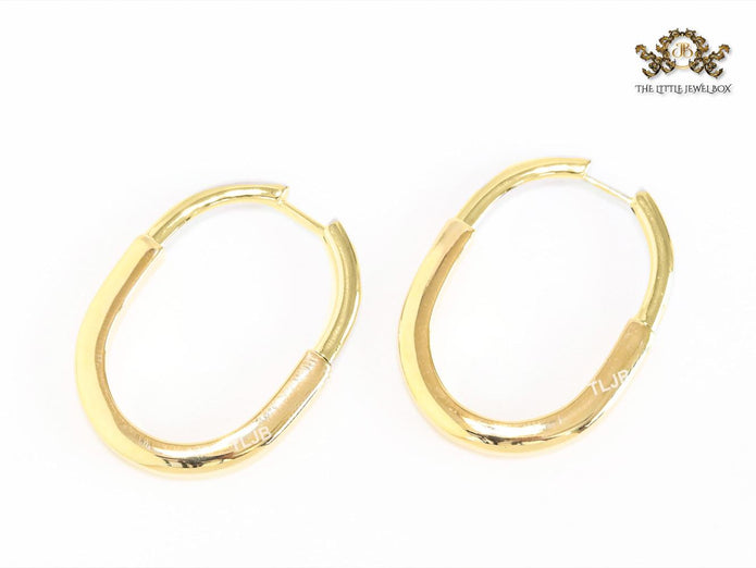 Alphabet T & Co. gold and cz oval hoops