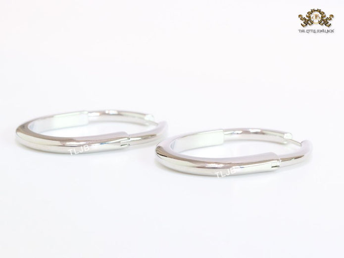 Alphabet T & Co. platinum and cz oval hoops