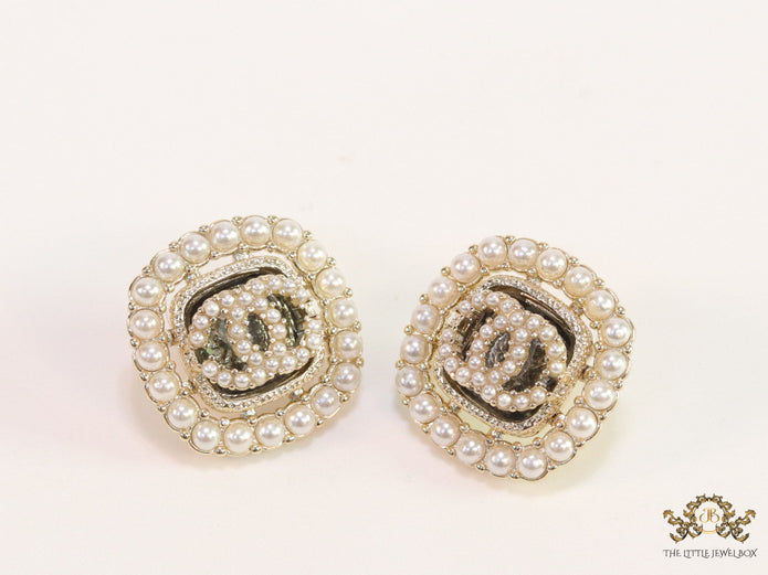 Pearl and cz studs with twin C motif