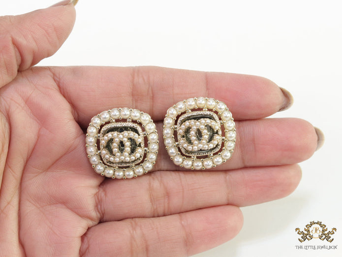 Pearl and cz studs with twin C motif
