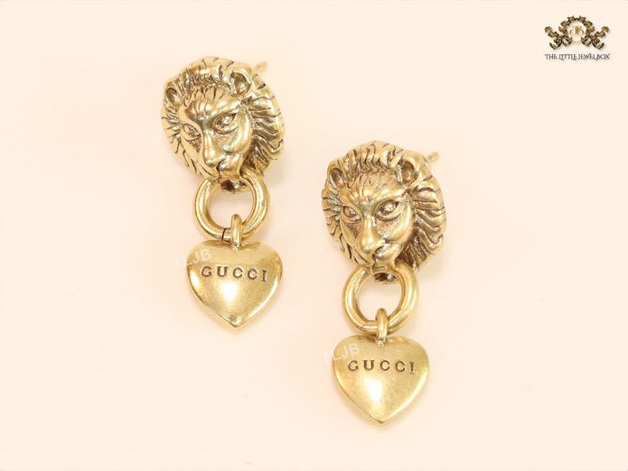 Antique lion face heart dangles