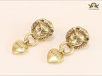 Antique lion face heart dangles