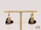 Golden and black enamel heart shape medusa earrings