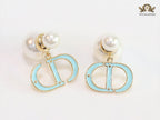 Pearl and aqua blue enamel CD bombers