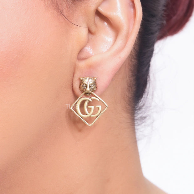 Twin G Studs with tiger motif