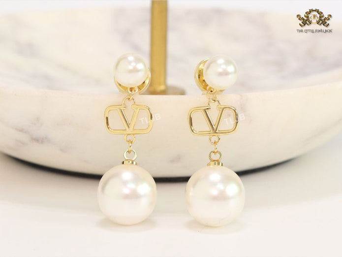Double pearl and alphabet V dangles