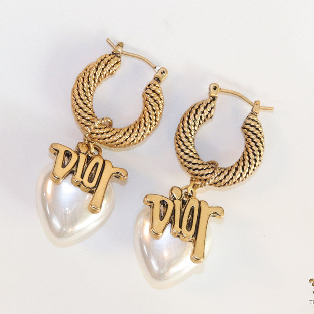 Golden hoops with alphabets and pearl drop