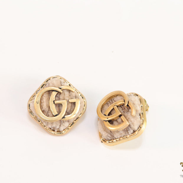 Cream velvet fur studs with golden twin G motif