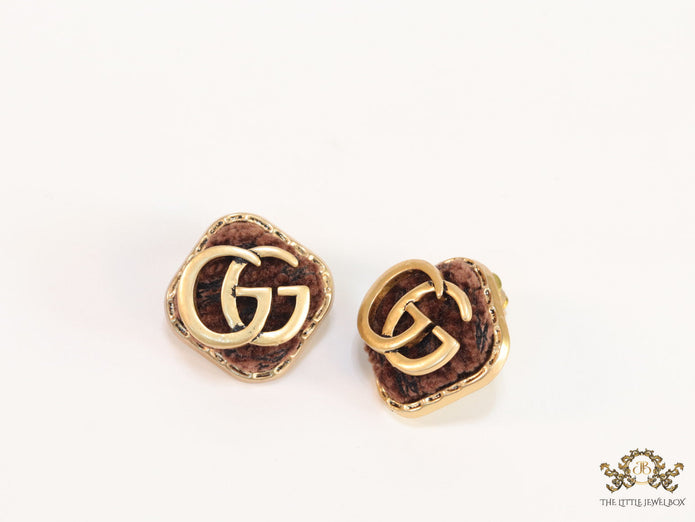 Brown velvet fur studs with golden twin G motif