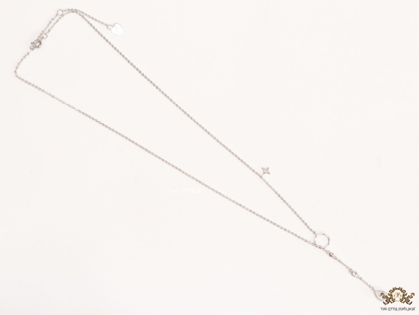 Platinum knot necklace with cz drop and small charms