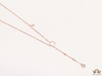 rose gold knot necklace with cz drop and small charms