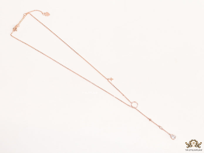 rose gold knot necklace with cz drop and small charms
