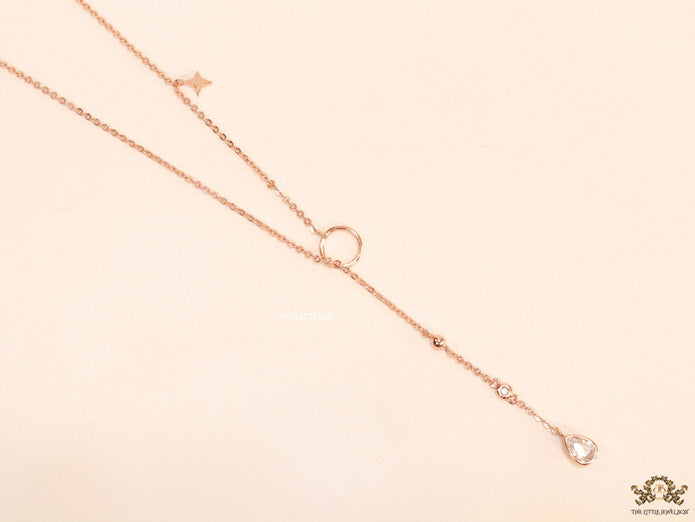 rose gold knot necklace with cz drop and small charms