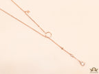 rose gold knot necklace with cz drop and small charms
