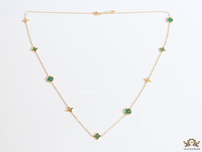 Golden chain necklace with malachite green clovers