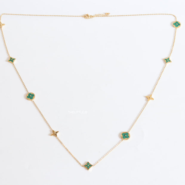 Golden chain necklace with malachite green clovers
