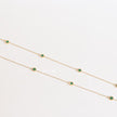 Golden chain necklace with malachite green roman numeral discs