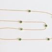 Golden chain necklace with malachite green roman numeral discs