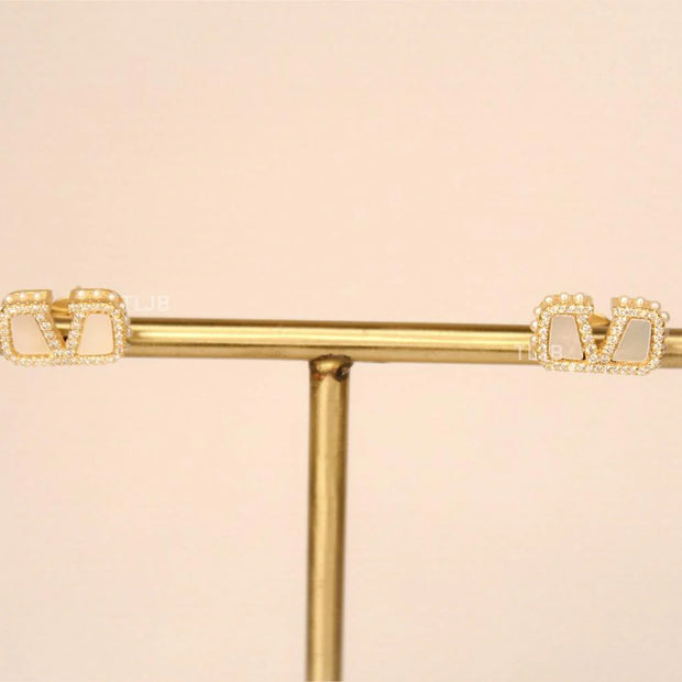 Alphabet V white mop earrings