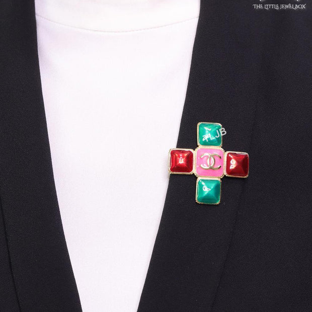Multi Coloured enamel coated golden brooch with twin C motif