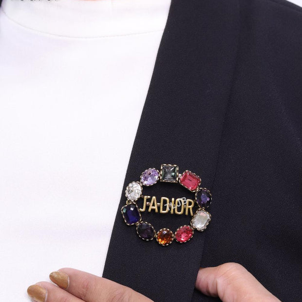 Multi stone brooch with alphabets