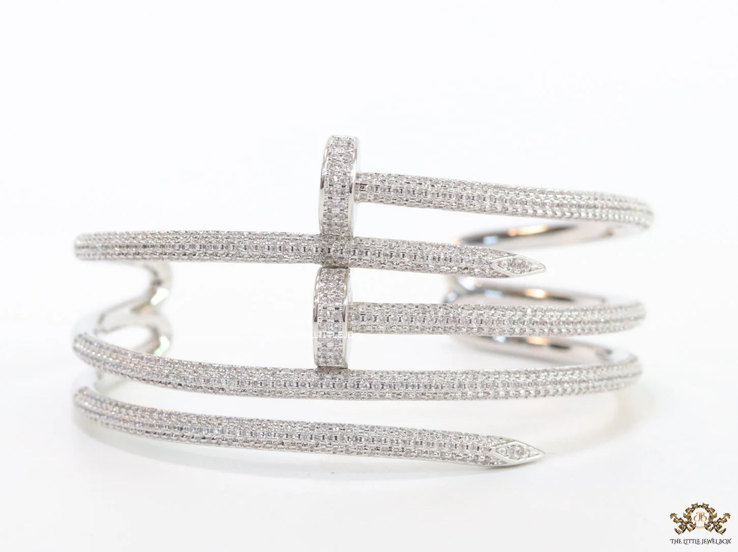 Platinum plated twin nail bracelet with cz