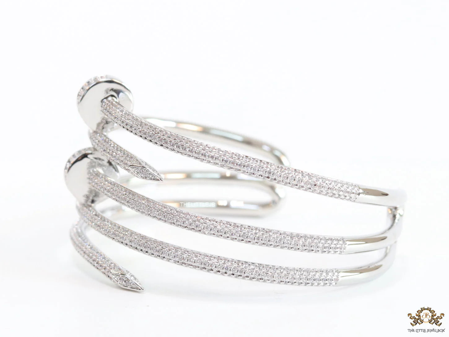 Platinum plated twin nail bracelet with cz