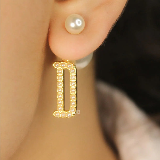 alphabet D pearl studded bomber earrings