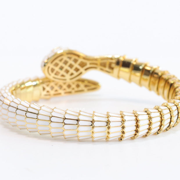Serpentine open bracelet in white enamel and golden finish