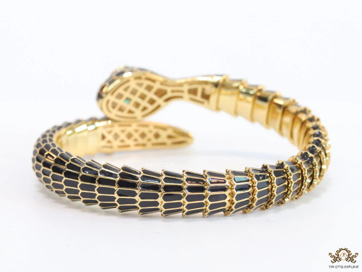 Serpentine open bracelet in black and golden finish