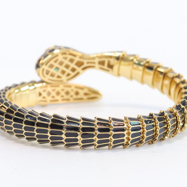 Serpentine open bracelet in black and golden finish