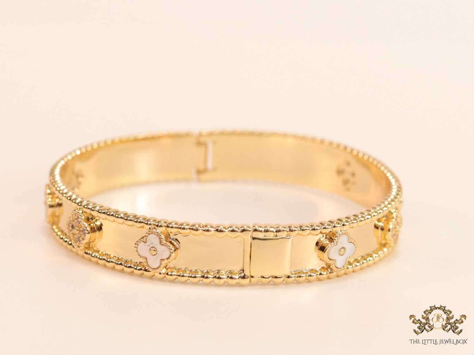 Gold plated bracelet with clover motifs in cz and MOP