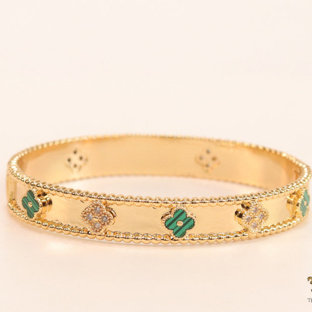 Gold plated bracelet with clover motifs in cz and malachite green