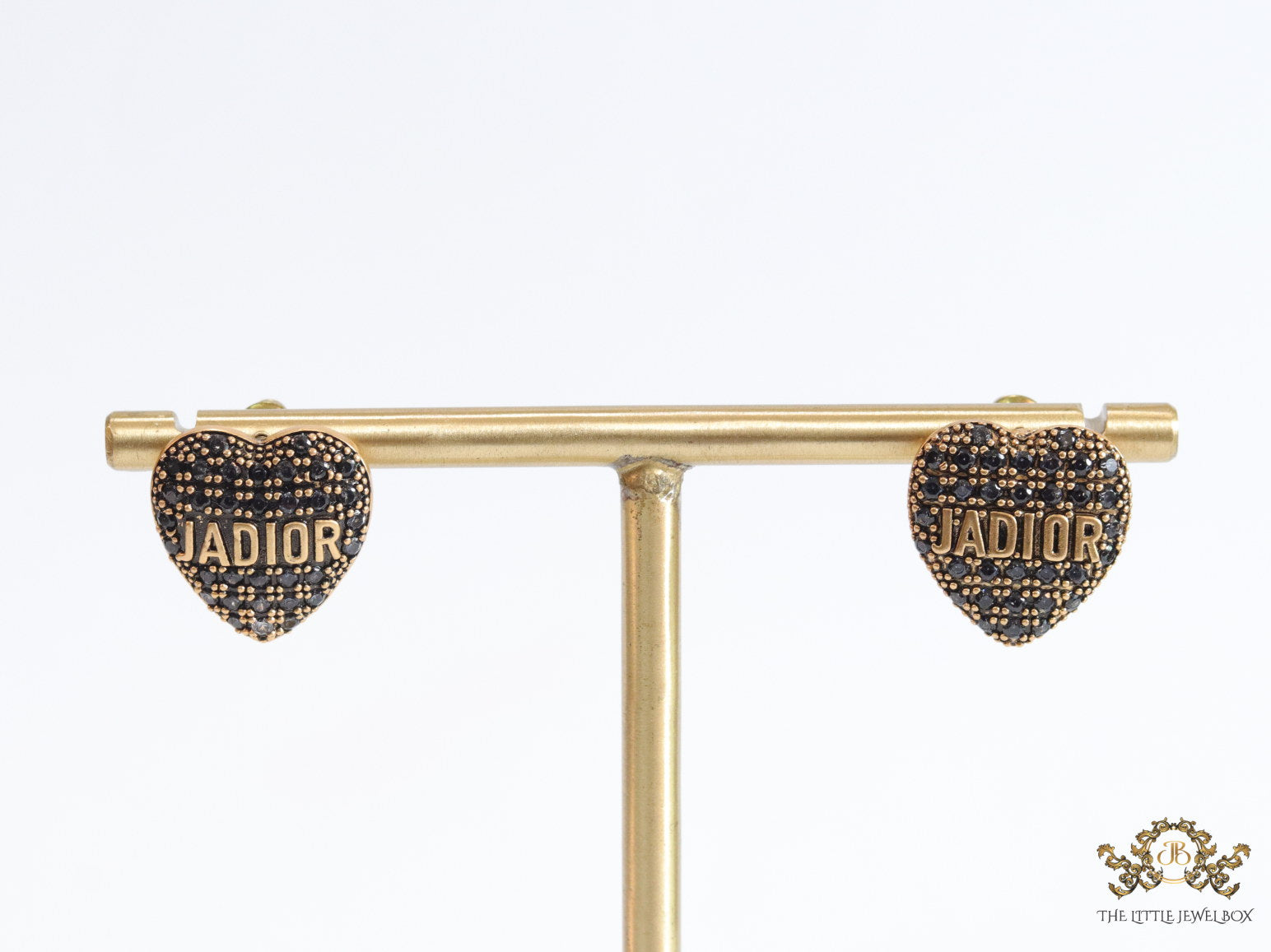Heart shaped alphabet stud earrings in golden and black finish