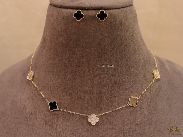 Gold plated necklace set with cz and black enamel coated clovers