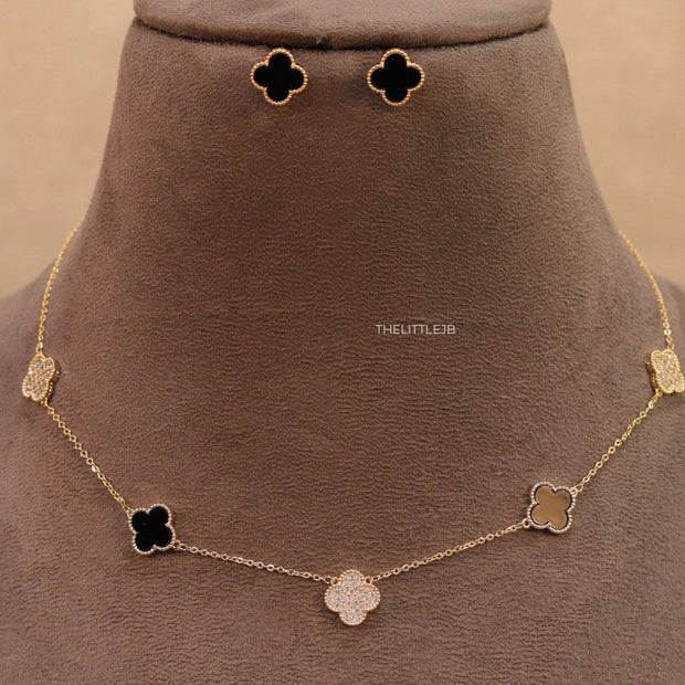 Gold plated necklace set with cz and black enamel coated clovers