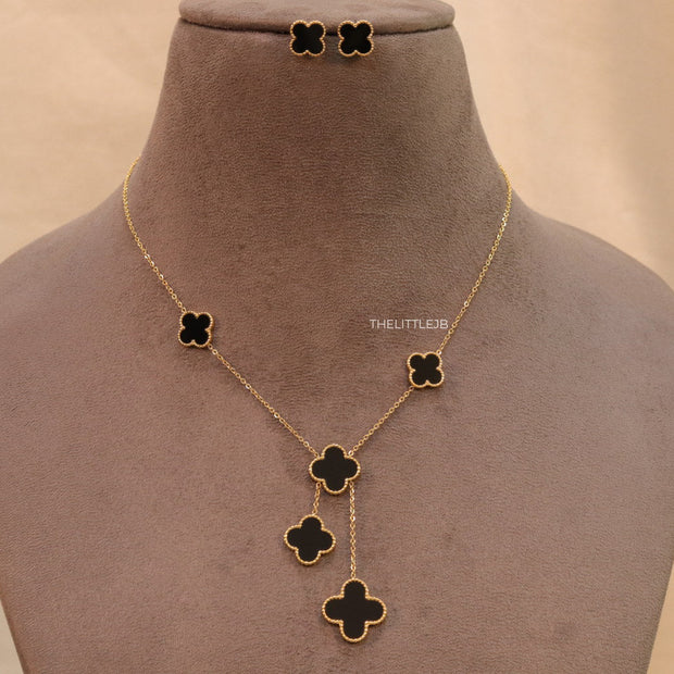 Gold plated necklace set with black enamel coated clovers